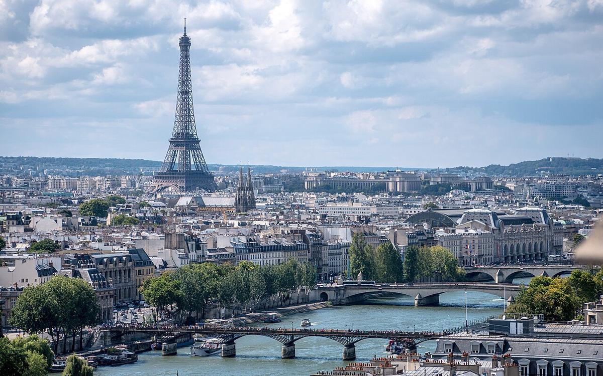 The Eiffel Tower above the rooftops of Paris, France
